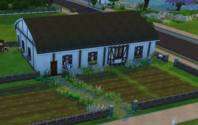 Gift recipient's Sims house design A Tudor-style country house surrounded by wildflowers and garden plots, designed in the Sims